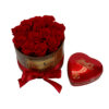 red lindt heart with chocolates besides wooden bucket of love with res roses